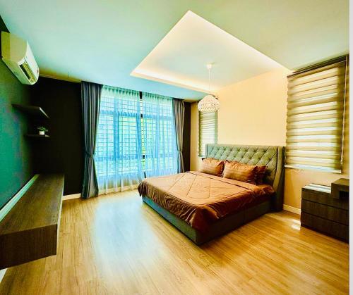 a bedroom with a bed and a large window at Luxury 5BR stay walk to beach & Night market fun in Batu Ferringhi