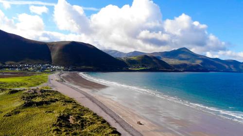 an aerial view of a beach with mountains in the background at Hotel Killarney in Killarney