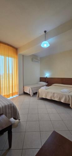 Postel nebo postele na pokoji v ubytování Hotel Ristorante La Decanata