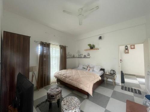 Katil atau katil-katil dalam bilik di Akaasa Home stays