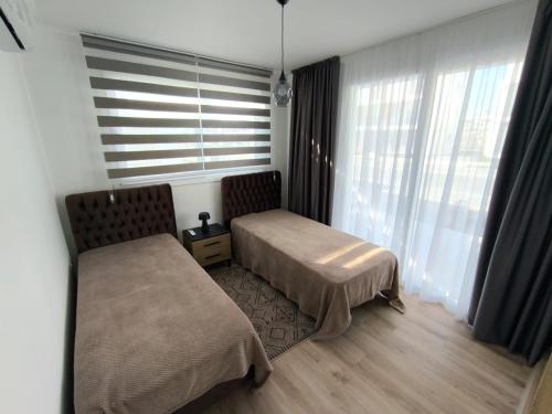 Postel nebo postele na pokoji v ubytování Luxury Two-Bedroom Apartment at Four Seasons Life 2 16-B