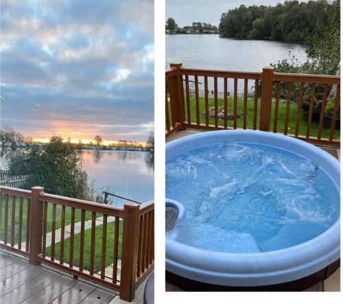 a hot tub on a deck with a view of a lake at The Lakeside 55 Caravan 8 Bert with Hot Tub at Tattershall Lakes in Tattershall