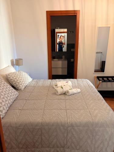 a bedroom with a bed with two towels on it at Aniene Home Roma in Rome