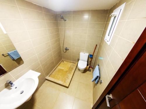 a bathroom with a sink and a toilet at Blue Residence Dahab in Dahab