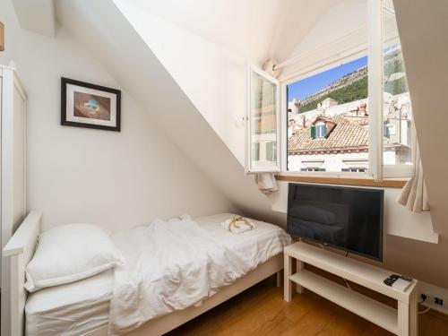 Posteľ alebo postele v izbe v ubytovaní Lumin Guest House