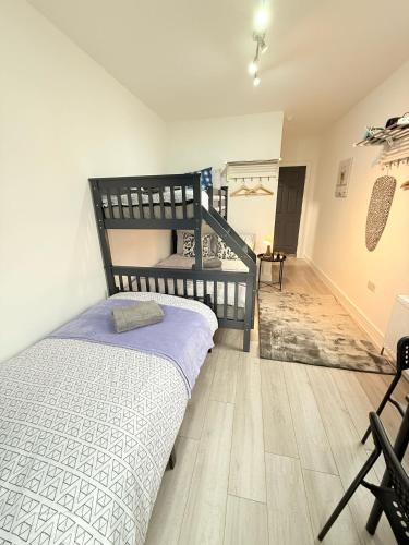 Katil atau katil-katil dalam bilik di Tottenham En Suites Guest Rooms
