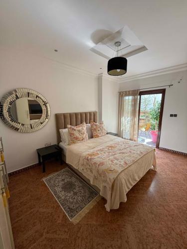 Postel nebo postele na pokoji v ubytování L'Appartement By PalmiResort