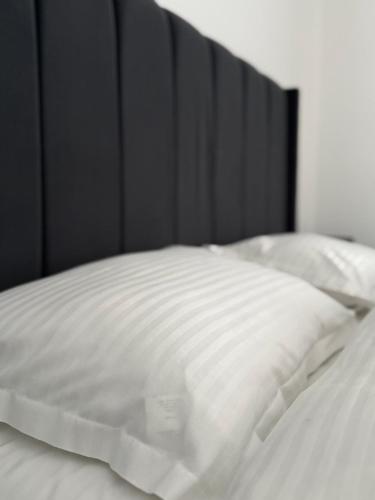 Postel nebo postele na pokoji v ubytování The Comfort Suite