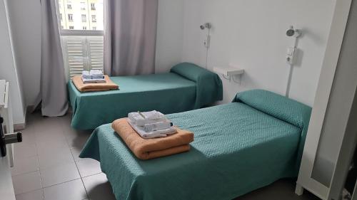 Ένα ή περισσότερα κρεβάτια σε δωμάτιο στο Motion Chueca Hostel