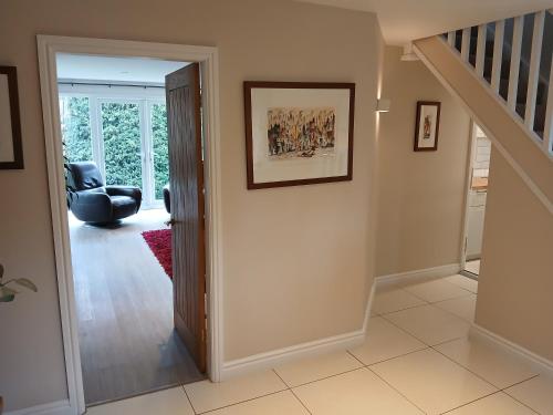 a hallway with a door leading into a living room at The Herons in Goldsborough