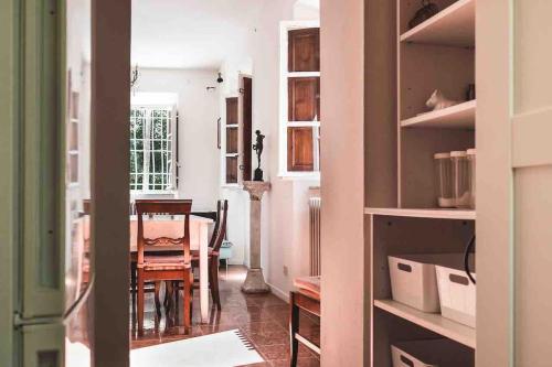 a kitchen with a table and a dining room at Villa Bianca charming Tuscany house with pool in Lucca