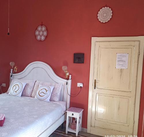 Postel nebo postele na pokoji v ubytování B&B Eleonora D'Arborea, Centro Storico