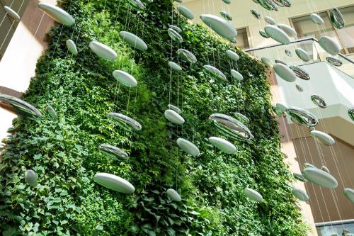 a building with a green wall with windows and plants at The Westin Pittsburgh in Pittsburgh