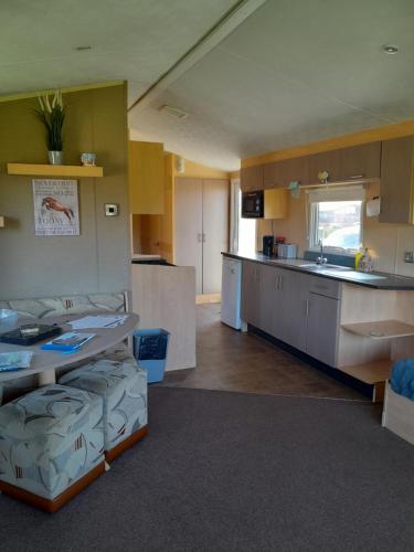 a large room with a kitchen and a counter top at L90 HOLIDAY HOMe in Mablethorpe