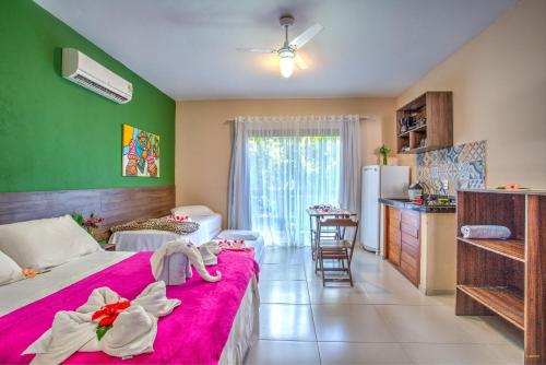 Un ou plusieurs lits dans un hébergement de l'établissement i9 Embaú Flats & Suites