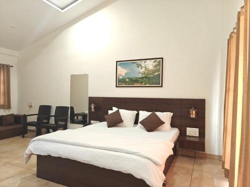 Postel nebo postele na pokoji v ubytování Ambrosia Resort