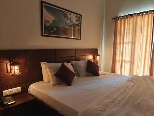 Postel nebo postele na pokoji v ubytování Ambrosia Resort