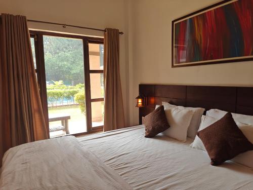 Postel nebo postele na pokoji v ubytování Ambrosia Resort