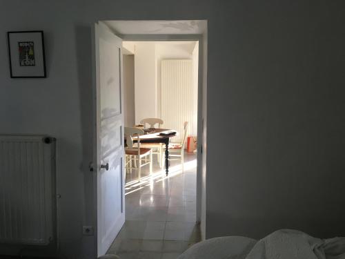 a room with a table and a dining room at Mymoustiers in Moustiers-Sainte-Marie