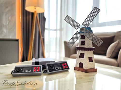 a lego windmill sitting on top of a table at Spacious Cozy Elysia Suite Johor Bahru Legoland in Iskandar Puteri