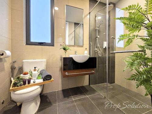a bathroom with a toilet and a sink and a shower at Spacious Cozy Elysia Suite Johor Bahru Legoland in Iskandar Puteri