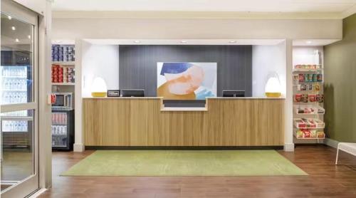 a store lobby with a counter in a store at Spark by Hilton Indianapolis Northeast Fishers in Fishers