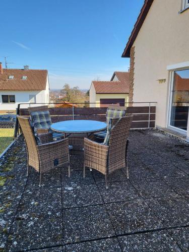 a patio with a table and chairs on a patio at DG-Ferienwohnung nähe Legoland, mit großer Terrasse in Sontheim an der Brenz