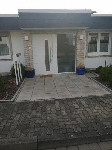 a front door of a house with a driveway at Schäfers Fewo in Bad Arolsen