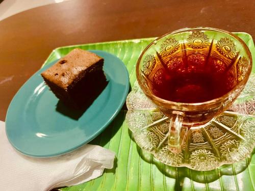 a plate with a piece of cake and a cup of tea at Vista villa in Panama