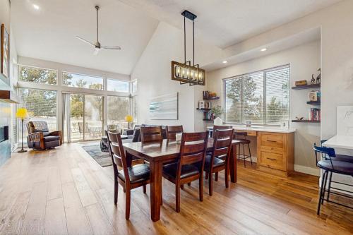 a kitchen and dining room with a table and chairs at Eagle Crest Family Retreat in Redmond