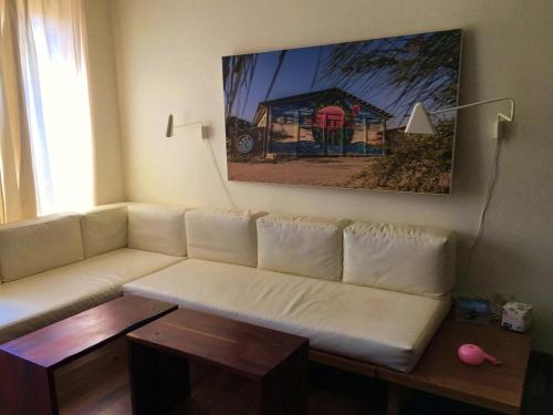 Posezení v ubytování Casa Flamenco en la playa con piscina y playa, un paraíso!