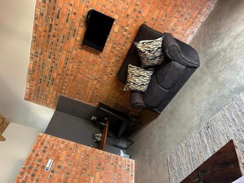 an overhead view of a living room with two couches at Klein Karoo Game Lodge in Oudtshoorn