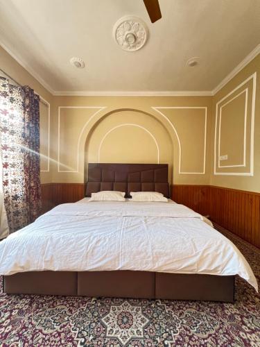 Postel nebo postele na pokoji v ubytování Al Rehman Homestay