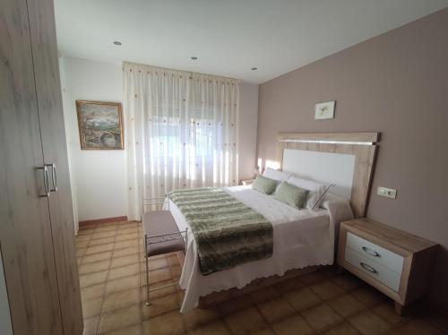 En eller flere senge i et værelse på Villa Santamaría