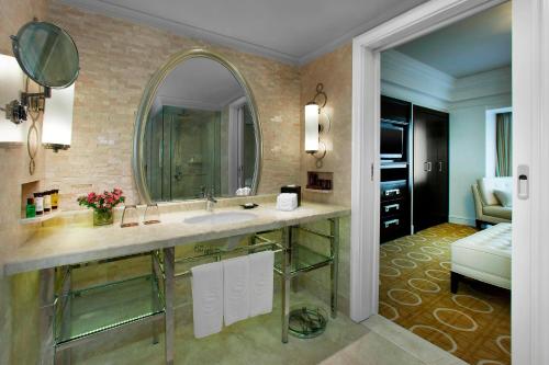 a bathroom with a sink and a mirror at Sheraton Xi'an Hotel in Xi'an