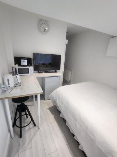 Voodi või voodid majutusasutuse Blue Moon Ensuite toas