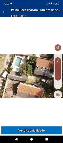 a screenshot of a cell phone with a picture of a house at Chácara paraíso in Tremembé