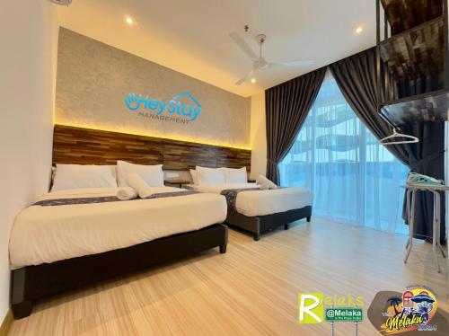 Katil atau katil-katil dalam bilik di TheWave Residence By Heystay Management