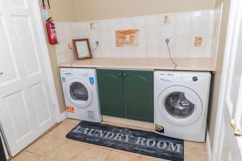 a laundry room with a washer and dryer at GlebeH Self Catering in Banagher