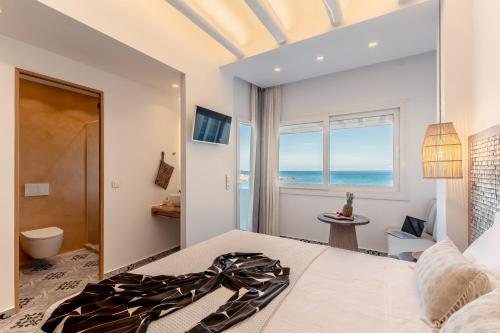 Posteľ alebo postele v izbe v ubytovaní Flèria Seaview Suites