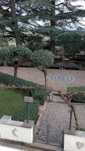 a park with a tree branch laying on the ground at Casa Vacanze Parco Azzurro - Il tuo angolo di tranquillita' ai Castelli Romani in Monte Compatri