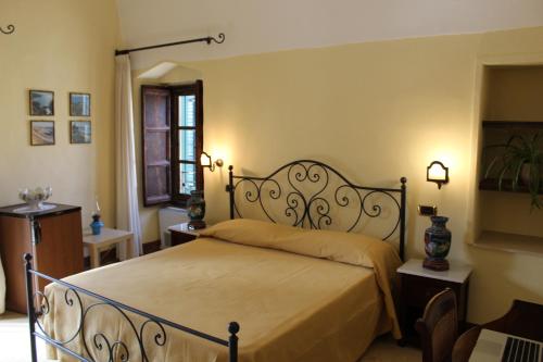 a bedroom with a bed in a room at Palazzo Senape De Pace in Gallipoli