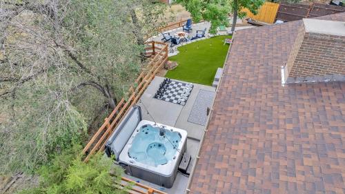 an aerial view of a hot tub on the roof of a house at Mountain Views Climbing wall Mini Golf Hot tub in Colorado Springs