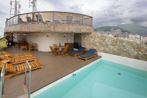 a house with a swimming pool on top of a building at B&B HOTEL Rio Copacabana Forte in Rio de Janeiro