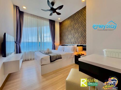 Postel nebo postele na pokoji v ubytování TheWave Residence By Heystay Management