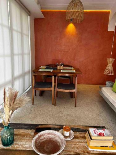 a living room with a table and a couch at Tropical Loft Living In Colombo 6 in Wellawatta
