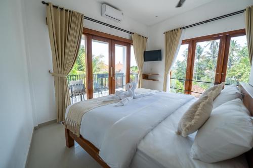 Postel nebo postele na pokoji v ubytování Lemon Tree Hotel Bali