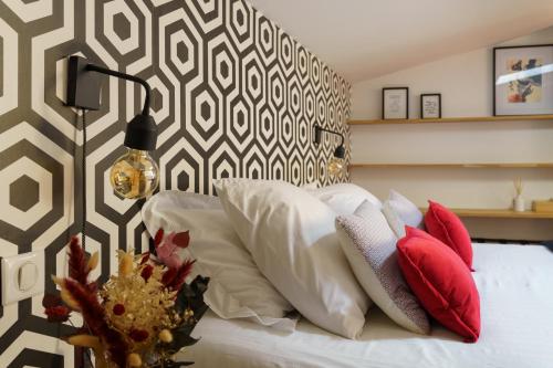 Кровать или кровати в номере L'appartement de Margot