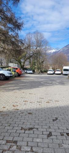 a parking lot with many cars parked in it at Maison de Sisi in Ugine
