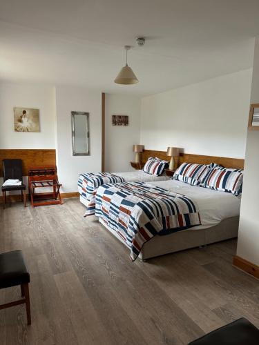 Katil atau katil-katil dalam bilik di Carranross Accommodation